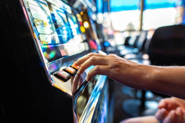 Mobile phone displaying live roulette table with multi-currency chip denominations